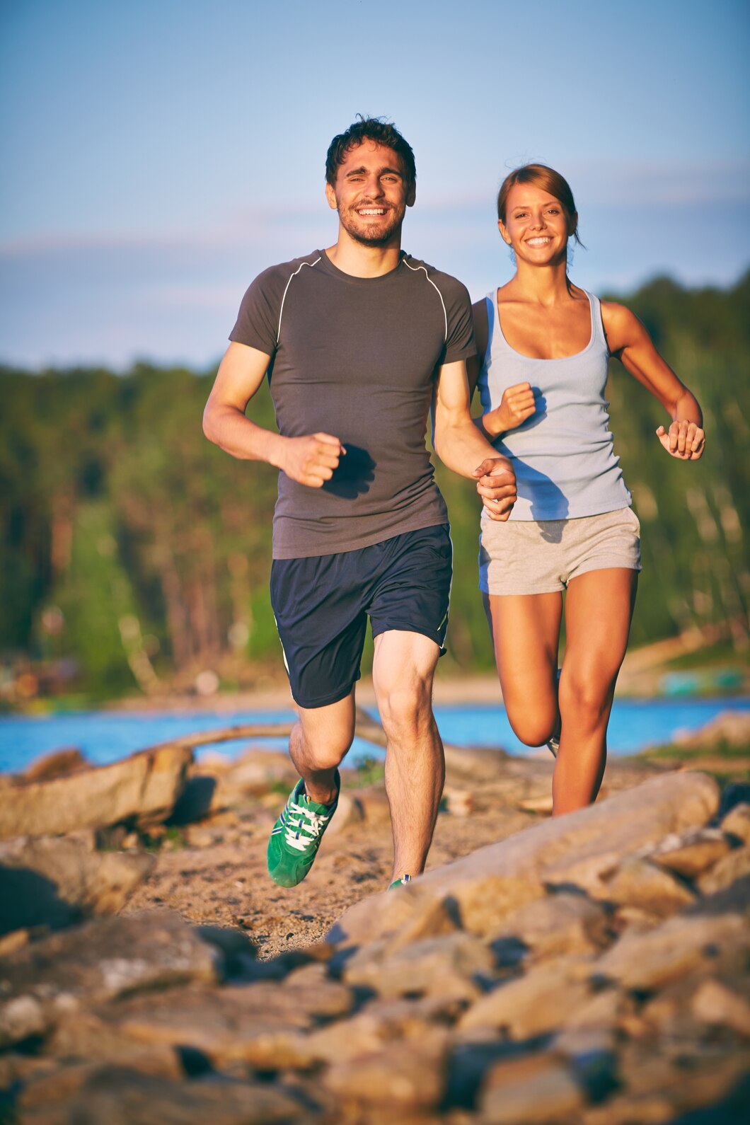 Young couple joyfully running outdoors - Vitamin B Complex